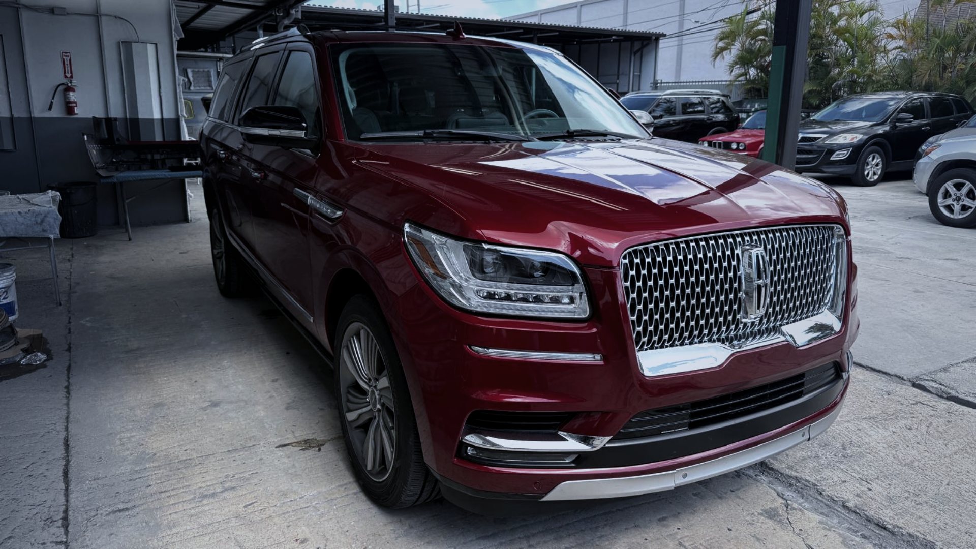 Red Lincoln Navigator in the LEY Auto Collision shop