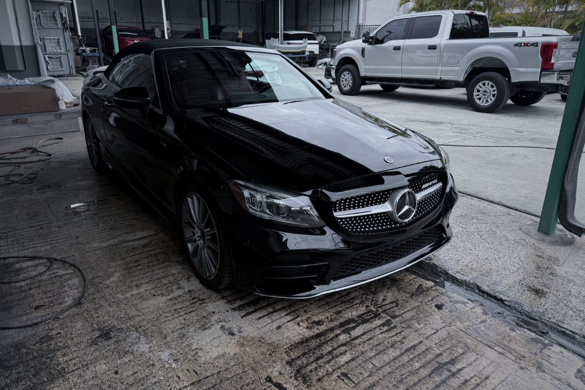 Black Mercedes-Benz C-Class convertible in the shop